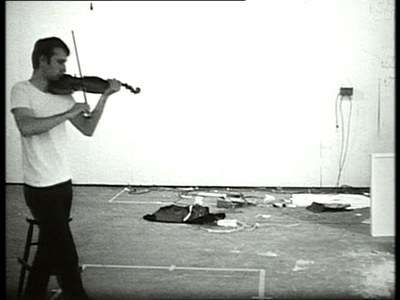 Playing a Note on the Violin While I Walk Around the Studio