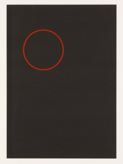 Rode cirkel op zwart papier