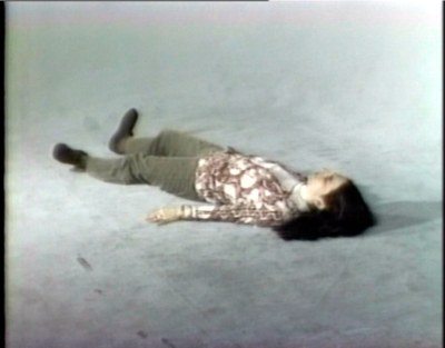 Elke Allowing the Floor to Rise Up Over Her, Face Up